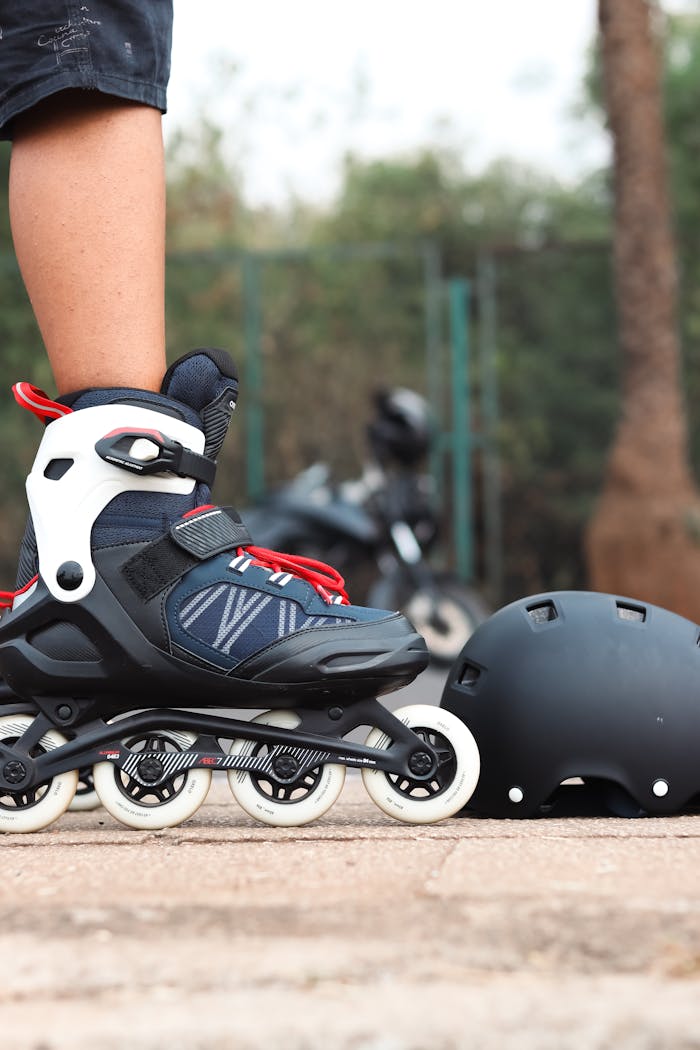 Close-up of inline skates and helmet on a roller rink in Mumbai.