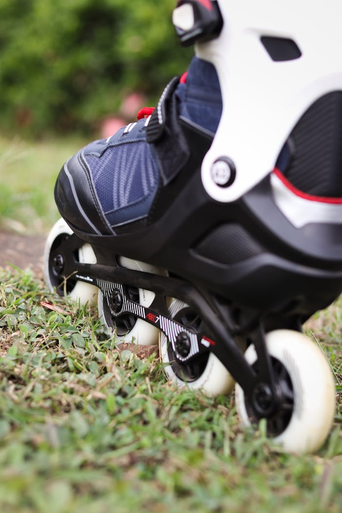 Detailed shot of a rollerblade on grass in Mumbai, India, ideal for summer sports themes.